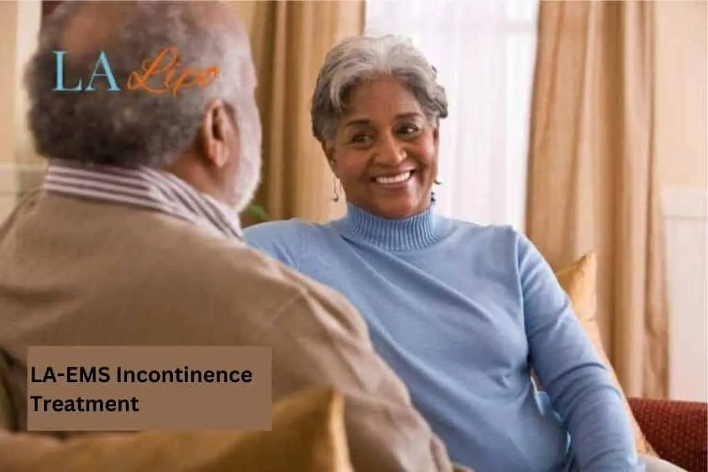 Couple sat smiling at each other - LA-EMS treatment North Wembley